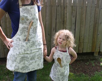 Mommy and me matching gray and cream aprons