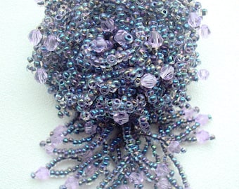 Brooch of beads and crystals