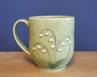 mug with lily of the valley flowers