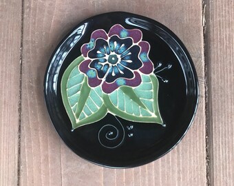 Wheel thrown and slip trailed spoon rest