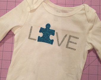 Baby autism awareness bodysuit.