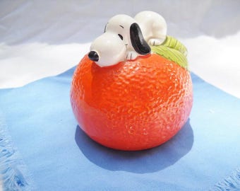 Vintage Snoopy Bank on an Orange