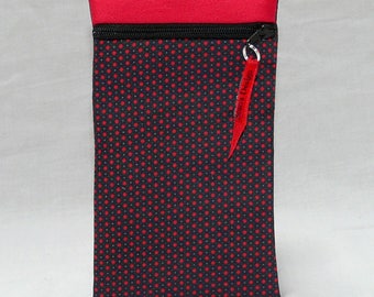 Case of laptop or door red and black button with red dots