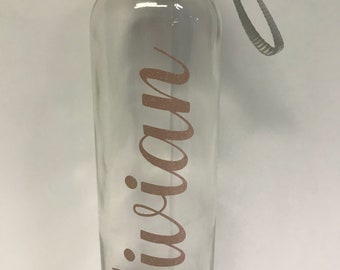 Personalized glass water bottle with carrying strap