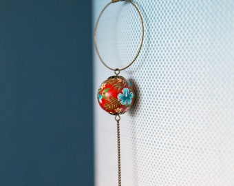 Exotic flowers on red necklace