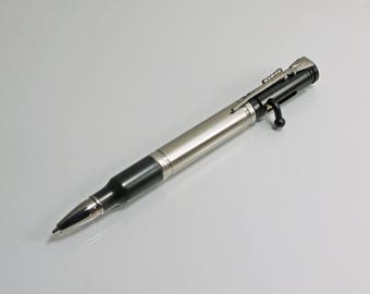 A .30 cal bolt-action bullet pen, solid stainless steel body, black enamel with gunmetal plated accents