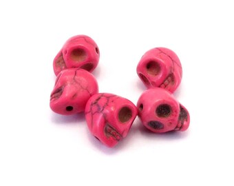 Set of 5 fuchsia howlite skulls
