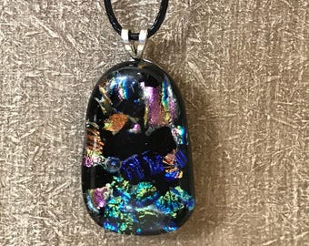 Dichroic glass pendant on black cord