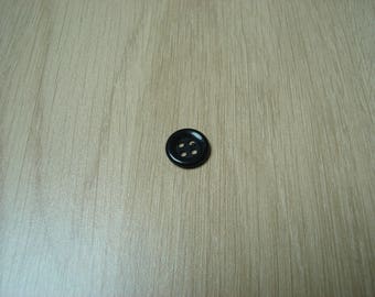 plastic button with big black rim