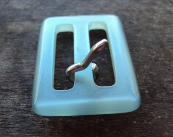 Pretty soft blue semi translucent plastic buckle