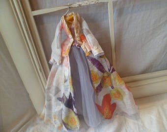 Fabric and paper miniature art dress and coat.