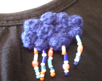 crocheted blue, rainy cloud brooch