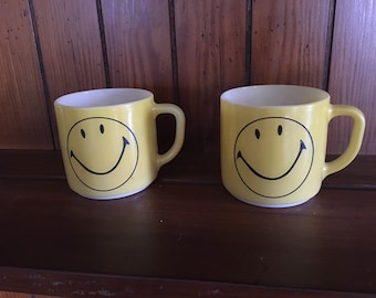2 Vintage yellow smiley face milk glass, Federal mugs