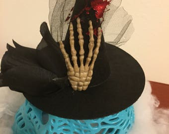 folding a tiny witch hat