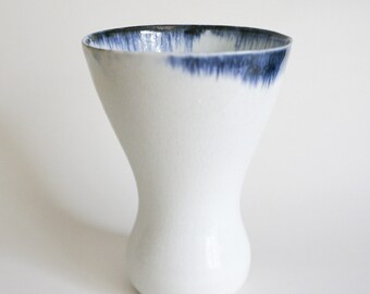 White porcelain vase with blue rim