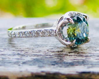 Unheated Blue Green Montana Sapphire Engagement Ring in Platinum with Diamonds and Scroll Details on Basket Size 5