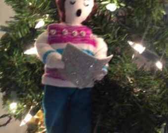 Christmas caroler in striped sweater