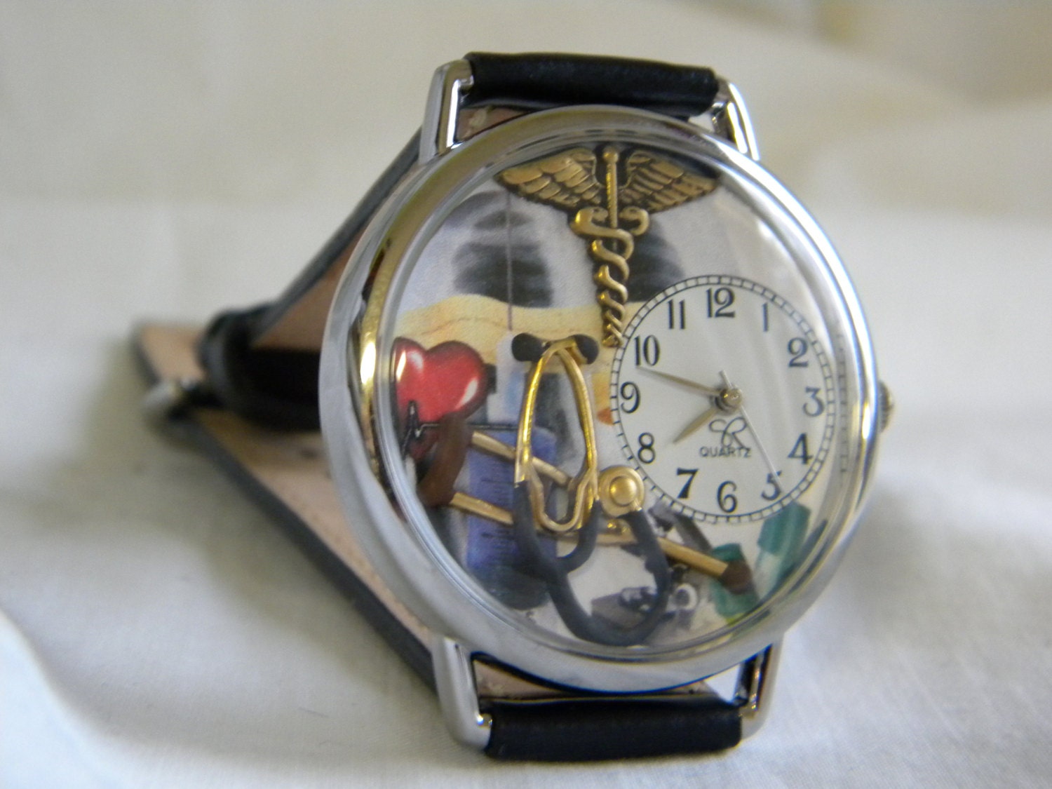 Doctors Watch with medical symbol stethoscope and crutch