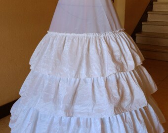 Three hoops and four ruffled crinoline petticoat.