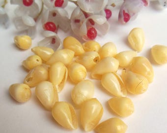 set of 25 yellow shell beads