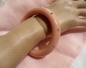 Vintage pink plastic bangle with Rhinestones (note - missing one Rhinestone)