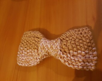 Pink knitted pale pink and old bow with flat edges