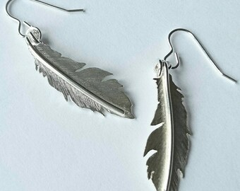 Sterling silver hand pierced feather earrings, hallmarked in Edinburgh.