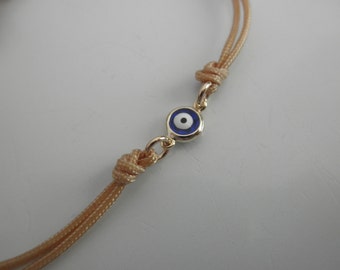blue evil eye bracelet gold framed