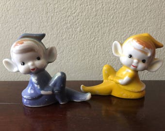 Two Ceramic Christmas Pixie Elves Yellow Blue