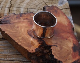 Sterling silver wide band. Hammered texture. Size 7
