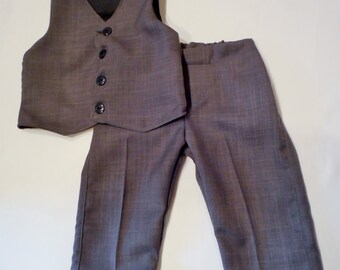 Gray Toddler suit with black lining. Boys suit in sizes 6-9 months - 5T. Made in a gray caramel suiting. Pants have elastic in the back