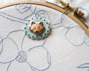 Ceramic Clay Needleminder, Sculpted and Painted Fox on Turquoise Blue Background, Oval with Scalloped Edge