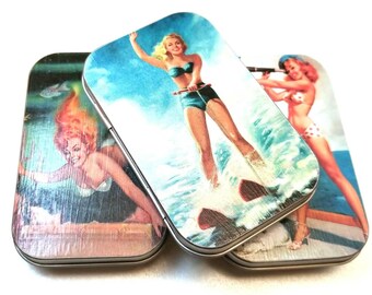 Large tin trio . . . Cheesecake ladies. Great for earrings.