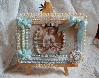 Small blue painting and her easel