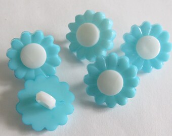 Turquoise and white flower shaped button