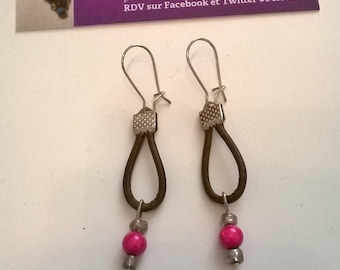 Dangle earrings are made of leather and glass beads pink
