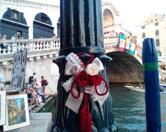 Tassel with roses and ribbons.