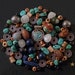 The Nepal beads and pendant in agate, lapis lazuli, turquoise, wood & metal yak bone