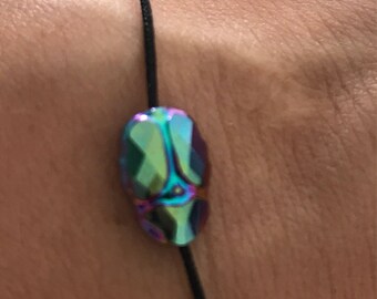 Iridescent skull charm adjustable cord bracelet