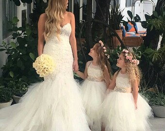 Stunning ivory 'Belle' flower girl dress, ivory sash,French lace, tea length poufy tulle skirt, ivory netting & ivory sash with rhinestone.