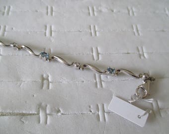 silver bracelet and zirconium