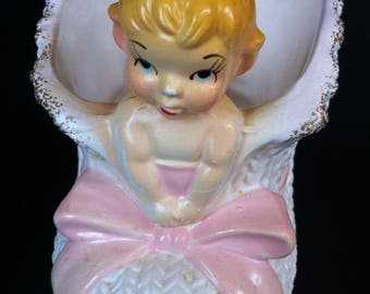 A Ceramic Textured Baby Bootie Planter With A Pixie/Girl On The Front And A Sticker That Reads PARMA By AAI Made In Japan