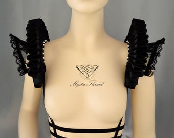 Black lace suspender shoulder pads decorated with black elizabethan ruffs and white Preciosa beads