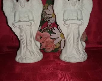 A set of Vintage beautiful Angel candle holders.Ceramic very detailed table center piece