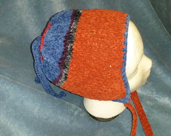 medium size child's blue/burnt orange hat with earflaps