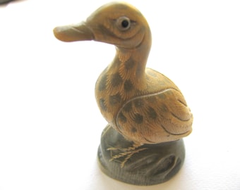 Horn bird, carved horn, tiny glass eyes, nicely detailed, 3 and 3 qtr inch tall, vintage item