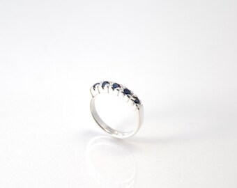 Silver ring with blue sapphires