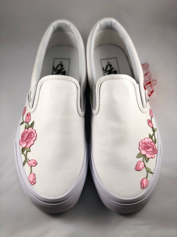 white slip on vans with pink roses