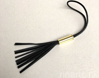 Bullet tassel bag charm / tassel purse charm in black full grain leather with brass bullet shell top. Bullet shell tassel purse charm