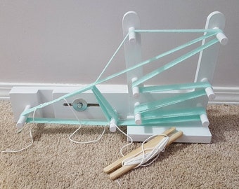 Inkle loom 2 yard hand made very sturdy slide adjustment. Weaves up to 4 inch belts or straps. Shuttle not included.